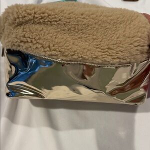 Juicy Couture Gold and Beige Cosmetic Bag on snapped on the sides to make larger